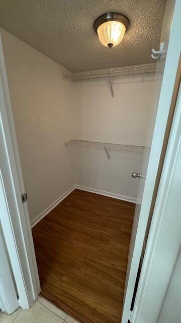 walk in closet featuring wood-type flooring