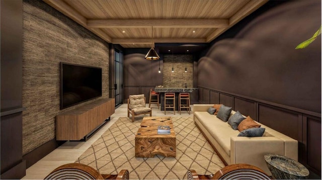 cinema with beamed ceiling, light hardwood / wood-style flooring, and wooden ceiling