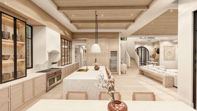 kitchen featuring pendant lighting, light brown cabinets, double oven range, wooden ceiling, and a large island