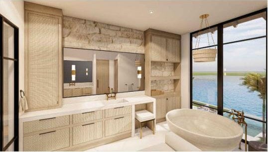 bathroom with a bathing tub, vanity, and a water view