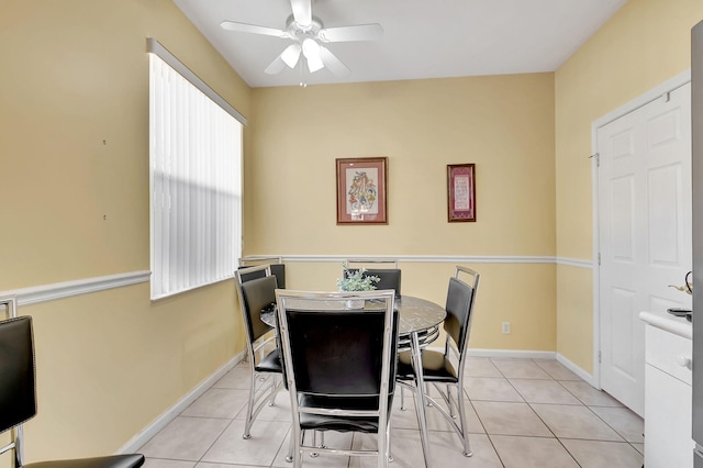 dining room with ceiling fan and light tile patterned floors