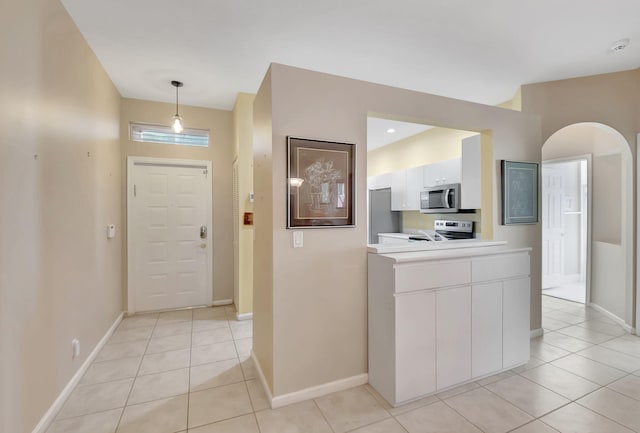 foyer entrance featuring light tile patterned floors