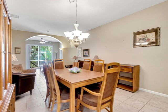 dining room featuring light tile patterned flooring and ceiling fan with notable chandelier