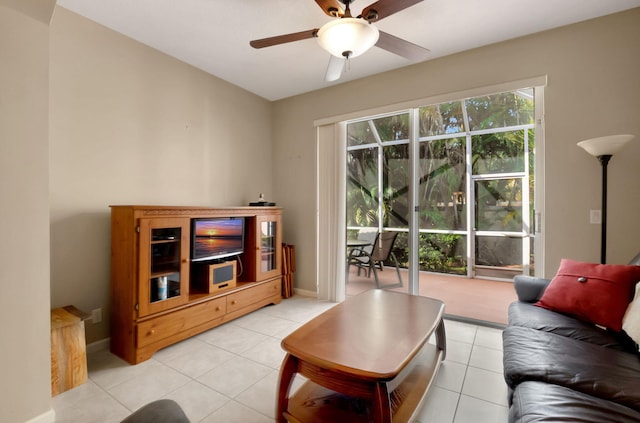 tiled living room with ceiling fan