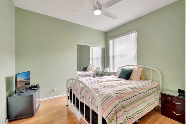 bedroom featuring ceiling fan and light wood-type flooring