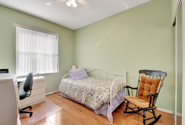 bedroom featuring ceiling fan and light hardwood / wood-style flooring