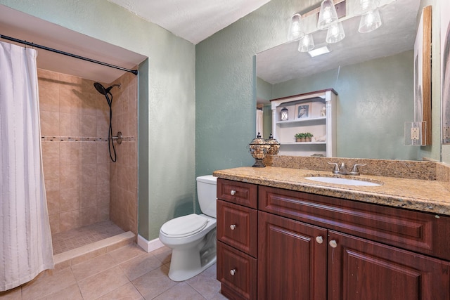 bathroom with tile patterned floors, a shower with curtain, vanity, and toilet