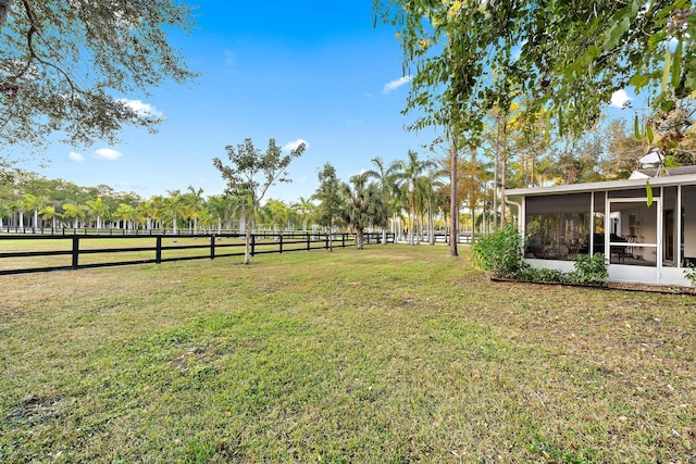 view of yard with a sunroom