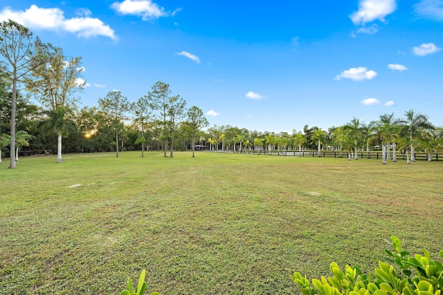 view of yard with a rural view