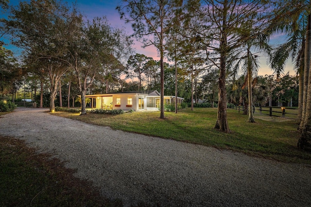 ranch-style house with a lawn