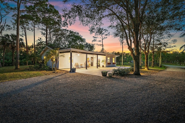 ranch-style home with a patio area