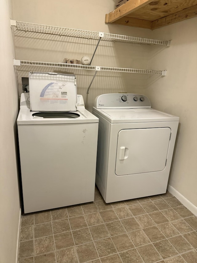 washroom with washing machine and dryer