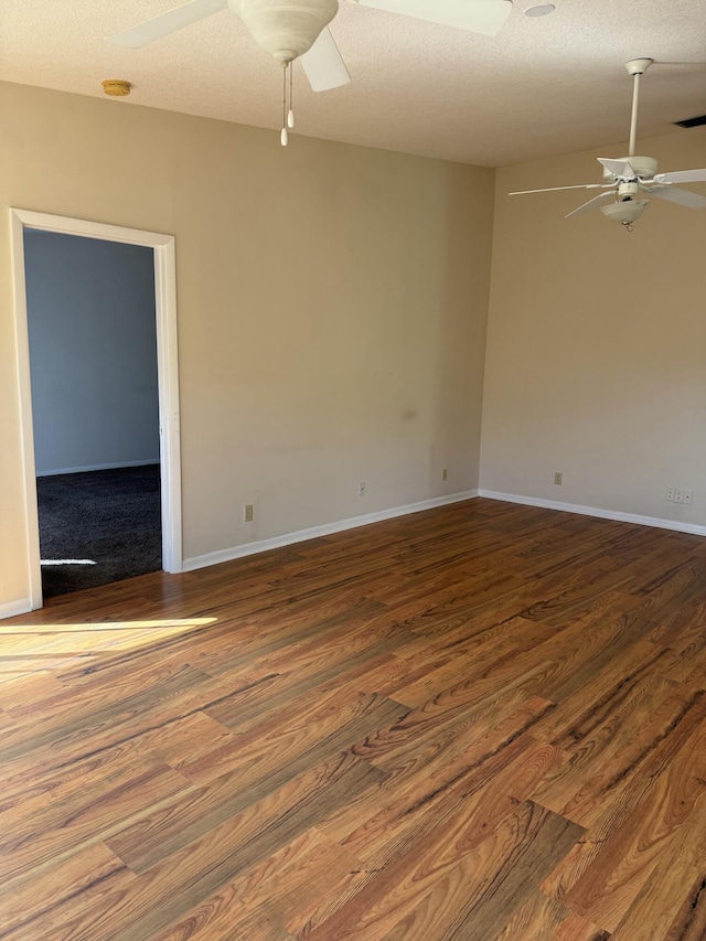 empty room featuring hardwood / wood-style floors, a textured ceiling, and ceiling fan