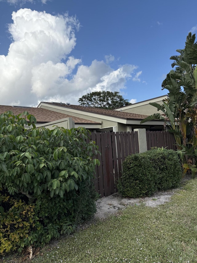 view of home's exterior featuring a lawn