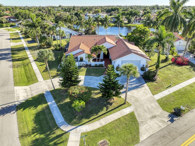 birds eye view of property featuring a water view