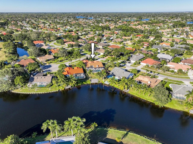 bird's eye view with a water view