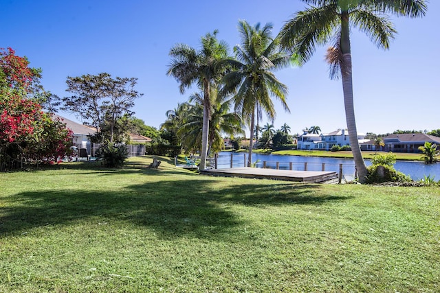 view of yard featuring a boat dock and a water view