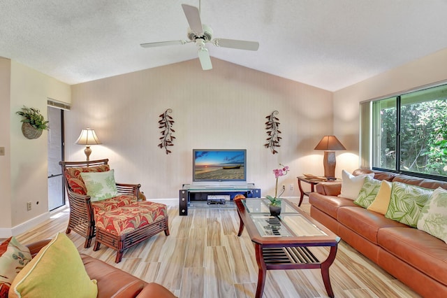 living room featuring a textured ceiling, ceiling fan, wood-type flooring, and lofted ceiling