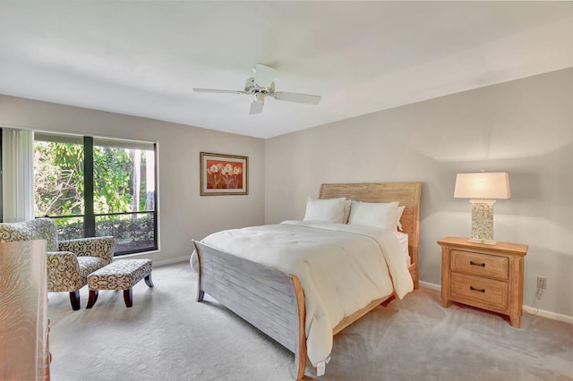 bedroom featuring ceiling fan and light colored carpet