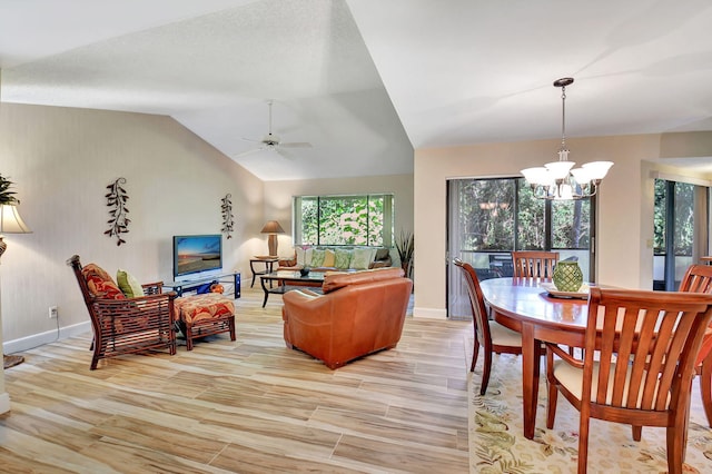 living room featuring ceiling fan with notable chandelier, light hardwood / wood-style floors, and lofted ceiling