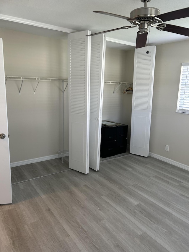 unfurnished bedroom featuring ceiling fan and light hardwood / wood-style flooring