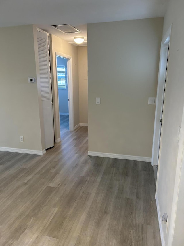 empty room with wood-type flooring