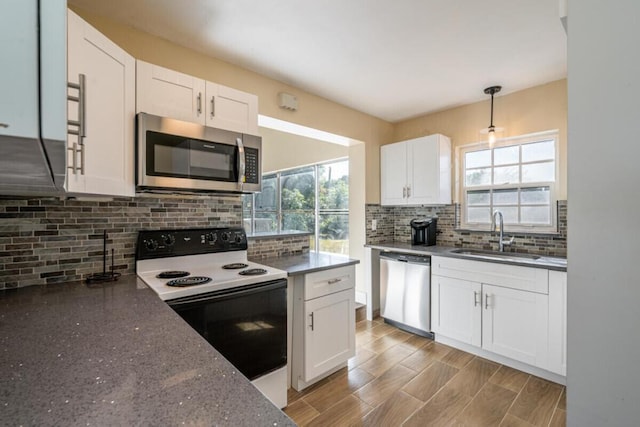 kitchen with white cabinetry, sink, and appliances with stainless steel finishes