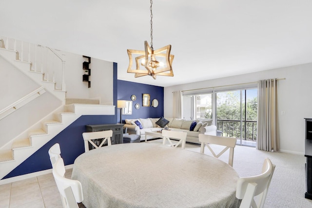 dining space featuring light colored carpet and an inviting chandelier