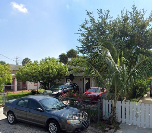 view of property hidden behind natural elements