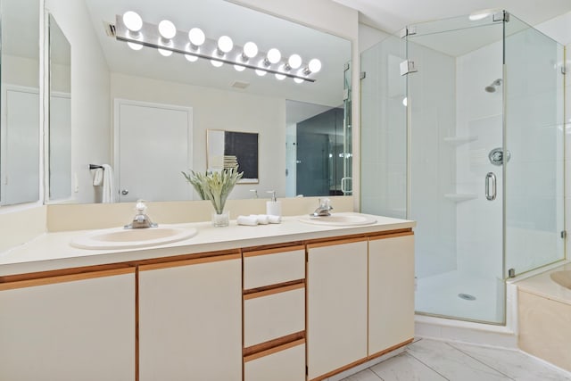 bathroom featuring vanity and plus walk in shower