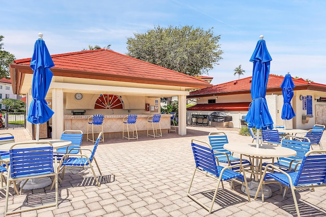 view of patio featuring a bar