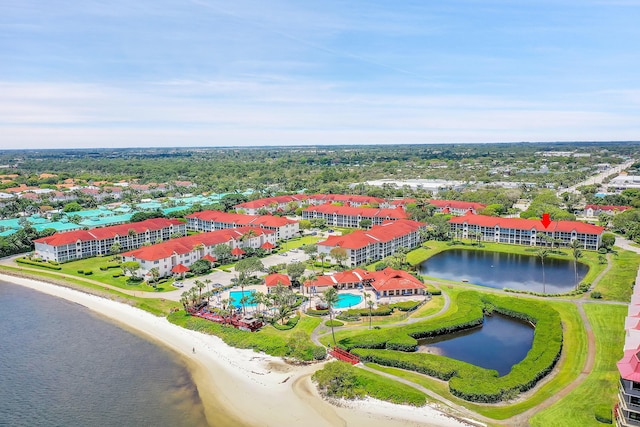 bird's eye view with a beach view and a water view