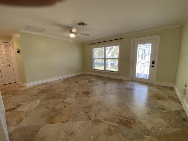 unfurnished room with ceiling fan and crown molding