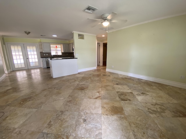 unfurnished living room featuring ceiling fan, french doors, and ornamental molding