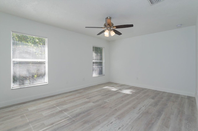 spare room featuring ceiling fan and light wood-type flooring