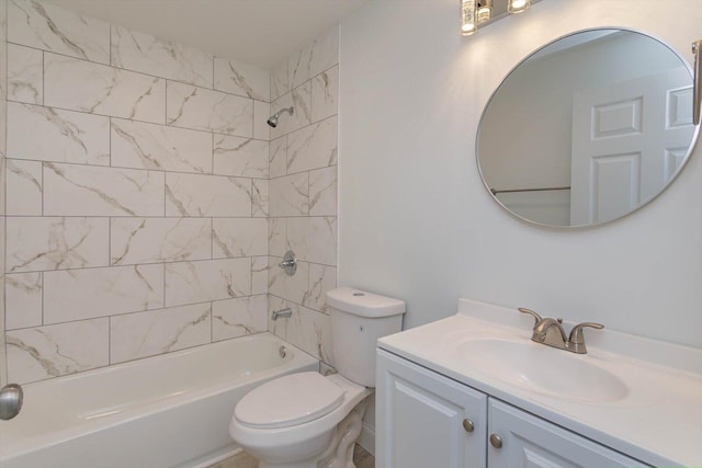 full bathroom with vanity, toilet, and tiled shower / bath