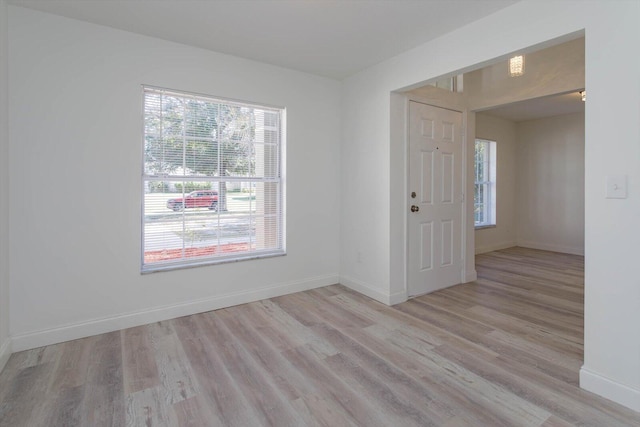 spare room with light hardwood / wood-style flooring