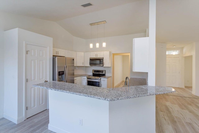 kitchen featuring kitchen peninsula, appliances with stainless steel finishes, light stone counters, light hardwood / wood-style flooring, and white cabinetry