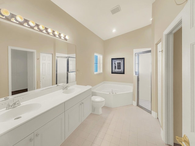 bathroom featuring a bath, visible vents, a stall shower, and a sink