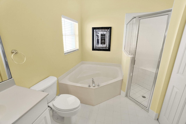 bathroom featuring a bath, a stall shower, toilet, and vanity