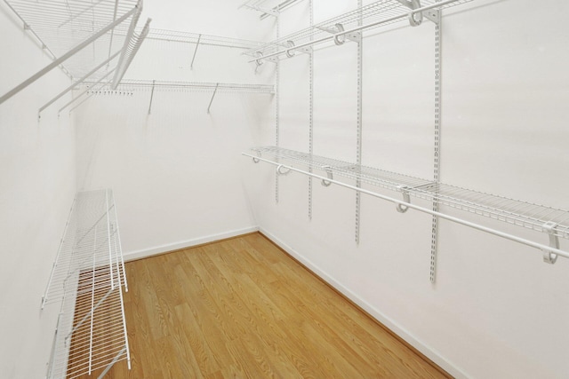 spacious closet with light wood-style floors