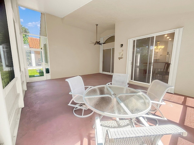 view of patio featuring a balcony and outdoor dining space