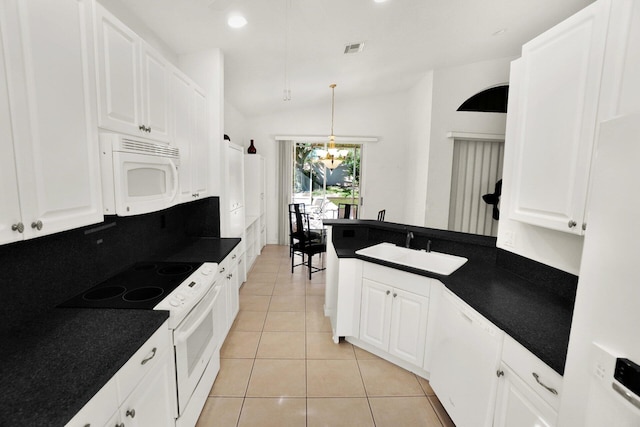 kitchen featuring a sink, white appliances, dark countertops, and white cabinets