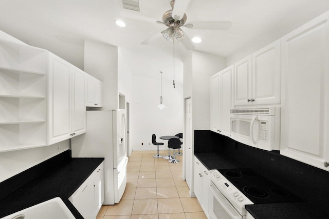 kitchen with white cabinetry, white appliances, and dark countertops