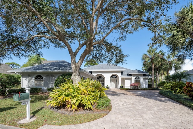 view of front of property with a front lawn