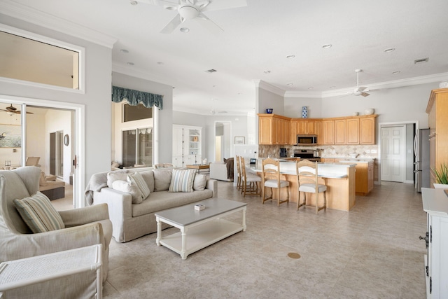 tiled living room with ornamental molding