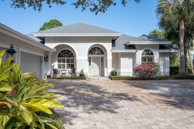 view of front facade with a porch and a garage