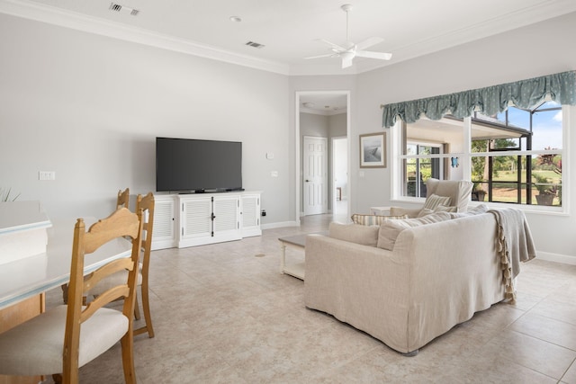 tiled living room featuring ceiling fan and crown molding