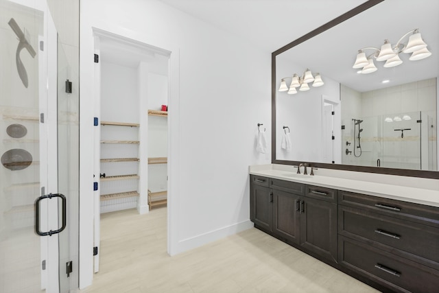 bathroom with vanity and an enclosed shower