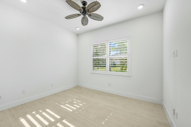 unfurnished room with ceiling fan and light wood-type flooring